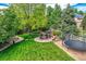 Large backyard with a firepit and a trampoline, perfect for Gathering gatherings and recreation at 14118 Whitney Cir, Broomfield, CO 80023