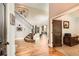 Grand entryway featuring a staircase, hardwood floors, and high ceilings with large windows at 14118 Whitney Cir, Broomfield, CO 80023