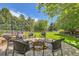 Inviting backyard firepit area with brick surround and ample seating for outdoor gatherings at 14118 Whitney Cir, Broomfield, CO 80023