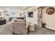 Finished basement with stone accents, a comfortable couch and recessed lighting at 14118 Whitney Cir, Broomfield, CO 80023