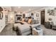 Finished basement with stone fireplace, large comfortable couch and a bar with seating at 14118 Whitney Cir, Broomfield, CO 80023