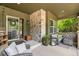 Inviting covered front porch with stone accents and comfortable seating area at 14118 Whitney Cir, Broomfield, CO 80023