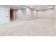 Spacious unfinished basement with neutral carpet, white trim, and potential for customization at 16075 E 109Th Pl, Commerce City, CO 80022