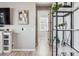 Hallway features wood floors and shelving with plants at 16075 E 109Th Pl, Commerce City, CO 80022