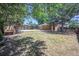 Large backyard with a mix of grass and dry patches at 7691 Osage St, Denver, CO 80221