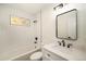 Charming bathroom offers a shower-tub combination with modern vanity and fixtures at 7691 Osage St, Denver, CO 80221