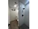 This bathroom features a new walk-in shower, vanity, and toilet at 7691 Osage St, Denver, CO 80221