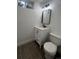 This updated bathroom features a new vanity, mirror, and toilet at 7691 Osage St, Denver, CO 80221