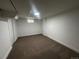 This bedroom features new carpet, a closet, and a window at 7691 Osage St, Denver, CO 80221