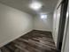 This bedroom features new floors, a closet, and a window at 7691 Osage St, Denver, CO 80221