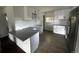 This kitchen features new countertops, cabinets, and stainless steel appliances at 7691 Osage St, Denver, CO 80221