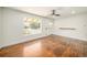 Bright living room features large window and wood floors at 7691 Osage St, Denver, CO 80221