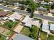 Aerial view of neighborhood home with solar panels, fenced yard and gravel driveway at 8641 Rutgers St, Westminster, CO 80031