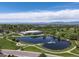 Picturesque aerial shot of a pond and recreation center, with mountains in the background at 8641 Rutgers St, Westminster, CO 80031