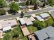 A charming home with a large yard, complemented by solar panels and a gravel driveway at 8641 Rutgers St, Westminster, CO 80031