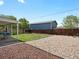 Well-maintained backyard with patio, lawn, wood privacy fence, and mulched and rock areas at 8641 Rutgers St, Westminster, CO 80031