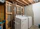 Utility area featuring washer and dryer hookups with exposed utilities and wood framing at 8641 Rutgers St, Westminster, CO 80031