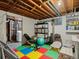 Unfinished basement area with storage, exercise equipment, and laundry hookups at 8641 Rutgers St, Westminster, CO 80031