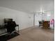 Spacious basement area featuring carpet floors, a home office, and play area at 8641 Rutgers St, Westminster, CO 80031