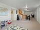 Open finished basement with carpeted floors, bar, workspace and play area at 8641 Rutgers St, Westminster, CO 80031