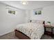 Bedroom with hardwood floors, a bed with floral print bedding and side table at 8641 Rutgers St, Westminster, CO 80031