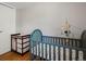 Comfortable Bedroom with hardwood floors and a crib at 8641 Rutgers St, Westminster, CO 80031