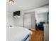 Bright bedroom with closet, chair, and hardwood floors at 8641 Rutgers St, Westminster, CO 80031