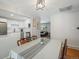 Open dining room showcasing white cabinetry and stainless steel appliances in an adjacent modern kitchen at 8641 Rutgers St, Westminster, CO 80031