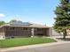 Lovely brick home featuring solar panels, a well-kept lawn and mature tree at 8641 Rutgers St, Westminster, CO 80031