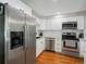 Updated kitchen with stainless steel appliances, including refrigerator, dishwasher, and oven, and plenty of storage at 8641 Rutgers St, Westminster, CO 80031