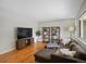 Cozy living room featuring hardwood floors, a comfortable sofa, and ample natural light at 8641 Rutgers St, Westminster, CO 80031
