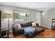 Inviting living room with a large window, hardwood floors, and modern furnishings at 8641 Rutgers St, Westminster, CO 80031