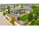 An aerial view of the property showing a well-maintained lawn and pergola at 9567 Juniper Way, Arvada, CO 80007