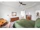 Bright, well-lit bedroom features modern decor and offers views into the ensuite bathroom at 9567 Juniper Way, Arvada, CO 80007