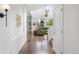 Bright entryway featuring hardwood floors and leading to the living room at 9567 Juniper Way, Arvada, CO 80007
