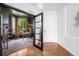 Home office featuring French doors, a large window, and a comfortable desk area at 9567 Juniper Way, Arvada, CO 80007