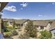 Aerial view of several homes with professionally landscaped yards and mountain views at 12685 W Montane Dr, Broomfield, CO 80021