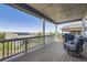 Covered outdoor deck boasts comfortable seating and neighborhood views at 12685 W Montane Dr, Broomfield, CO 80021