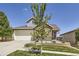 Charming two-story home with stone accents, mature tree, and a well-kept front yard at 12685 W Montane Dr, Broomfield, CO 80021
