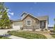 Beautiful two-story home with stone accents, well-manicured lawn, and inviting curb appeal at 12685 W Montane Dr, Broomfield, CO 80021