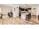 Beautiful open-concept kitchen featuring an island, stainless steel appliances, and modern finishes at 12685 W Montane Dr, Broomfield, CO 80021