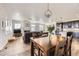 Bright and airy living space seamlessly connecting the living room, dining area, and kitchen at 12685 W Montane Dr, Broomfield, CO 80021