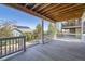 Outdoor patio with wood beam ceiling, stairs, and view of neighboring houses at 12685 W Montane Dr, Broomfield, CO 80021