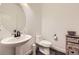 Tastefully designed powder room with a pedestal sink and modern fixtures at 12685 W Montane Dr, Broomfield, CO 80021