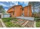 Back exterior of house shows upstairs balcony, new patio, and a garden area at 13028 Garfield Dr, Thornton, CO 80241