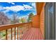 Upstairs balcony with wooden floors and railing offers great outdoor space at 13028 Garfield Dr, Thornton, CO 80241