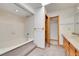 Bathroom with a tub and shower combination, a skylight, and access to the bedroom at 13028 Garfield Dr, Thornton, CO 80241