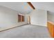 Upstairs bedroom featuring neutral carpet, modern windows and architectural wood beam at 13028 Garfield Dr, Thornton, CO 80241