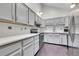 Charming kitchen with white cabinets, stainless steel appliances, and sleek countertops at 13028 Garfield Dr, Thornton, CO 80241
