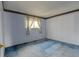Cozy bedroom featuring a window with patterned curtains and blue carpet at 9766 Fillmore St, Thornton, CO 80229